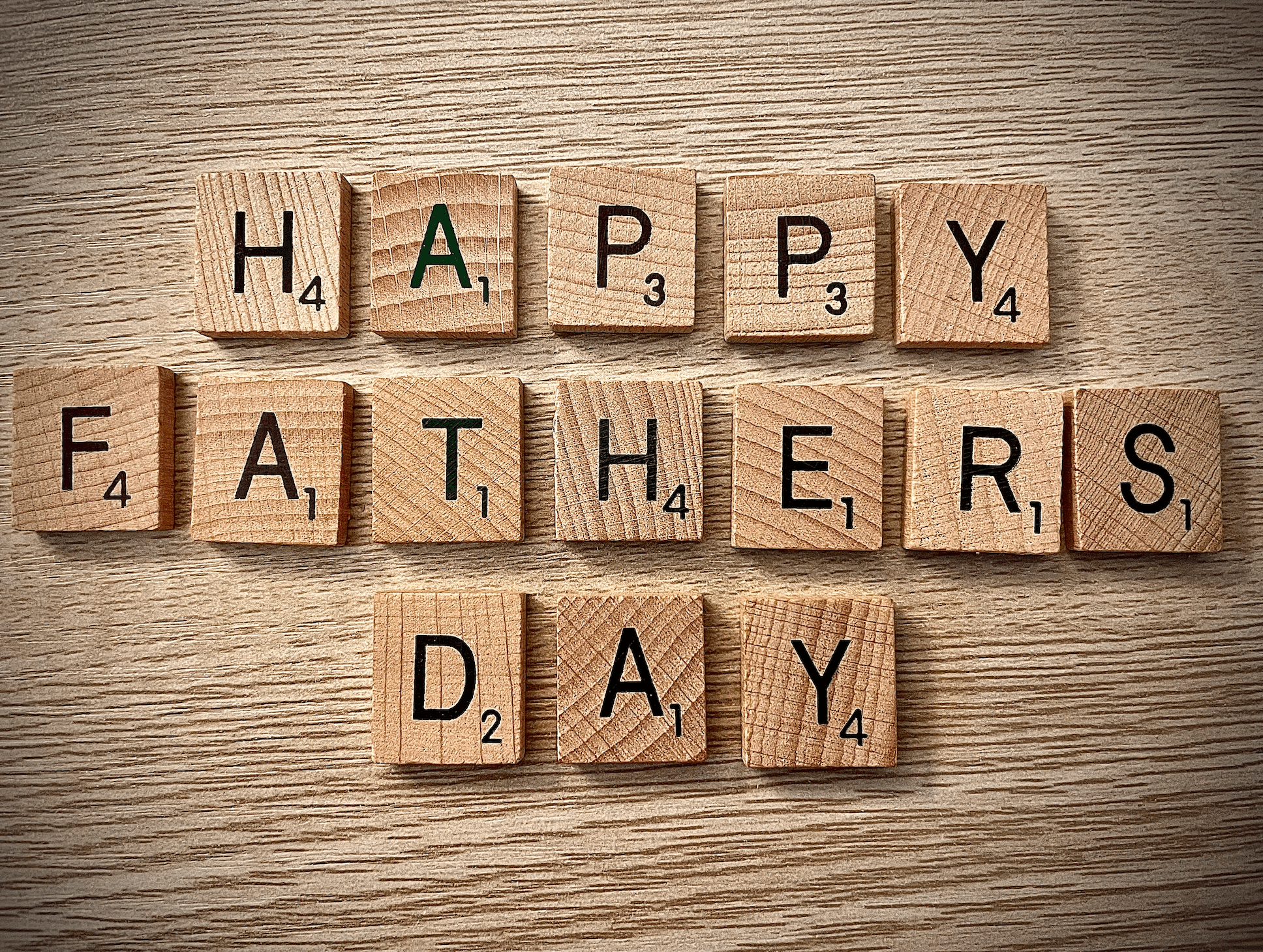 Scrabble Tiles spell out "Happy Father's Day"